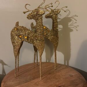 Gold sequence reindeers medium & large. Can sell together or in pairs.